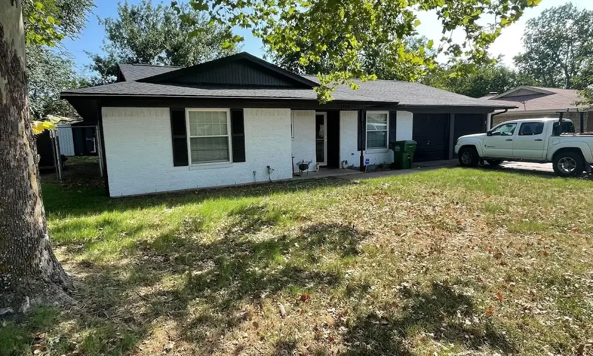 Professional roofing crew working on a residential roof in North Charleston